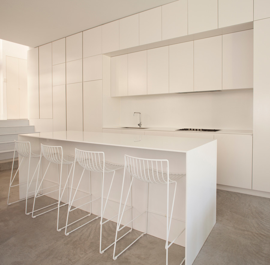 Design ideas for a mid-sized beach style galley kitchen pantry in Sydney with open cabinets and with island.