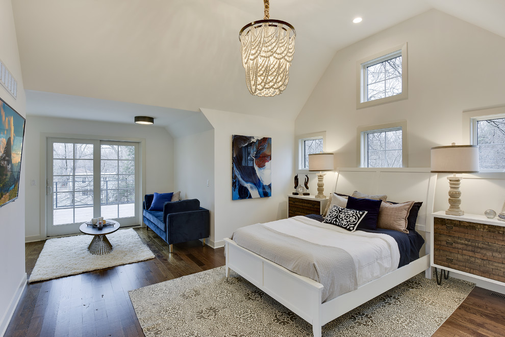 Design ideas for a large transitional master bedroom in Minneapolis with white walls, dark hardwood floors and brown floor.