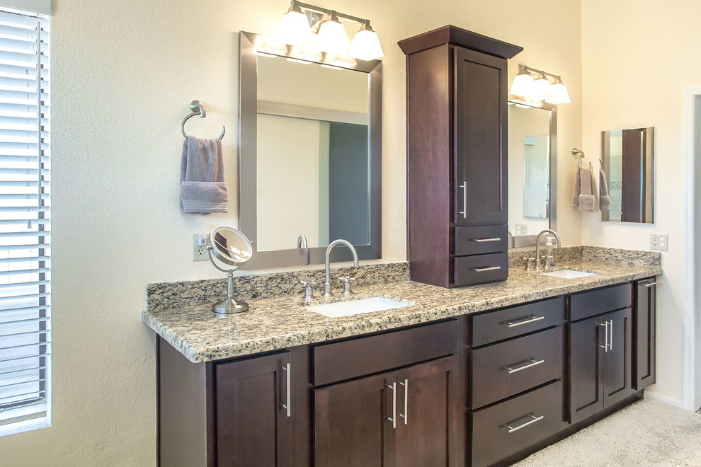 Example of a large transitional master brown tile and porcelain tile ceramic tile walk-in shower design in Phoenix with recessed-panel cabinets, dark wood cabinets, a two-piece toilet, beige walls, an undermount sink and granite countertops