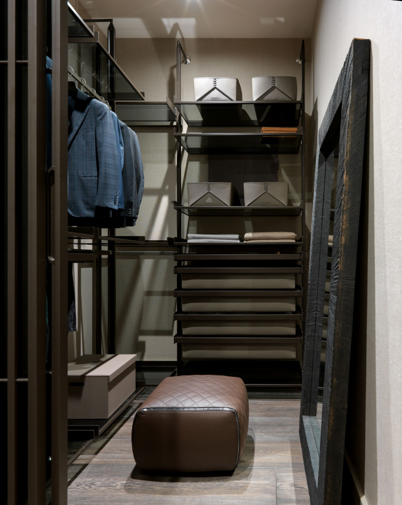 This is an example of a large contemporary storage and wardrobe in Moscow with dark hardwood floors and brown floor.