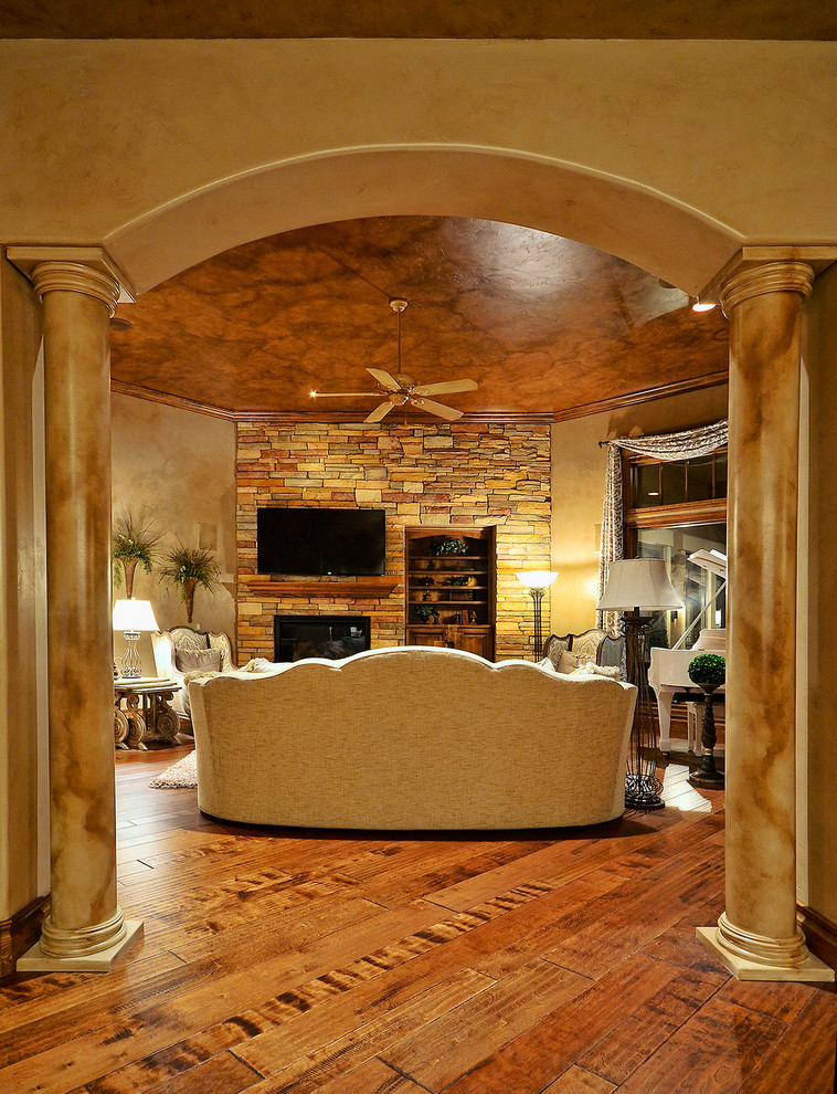 Example of a transitional home design design in Denver