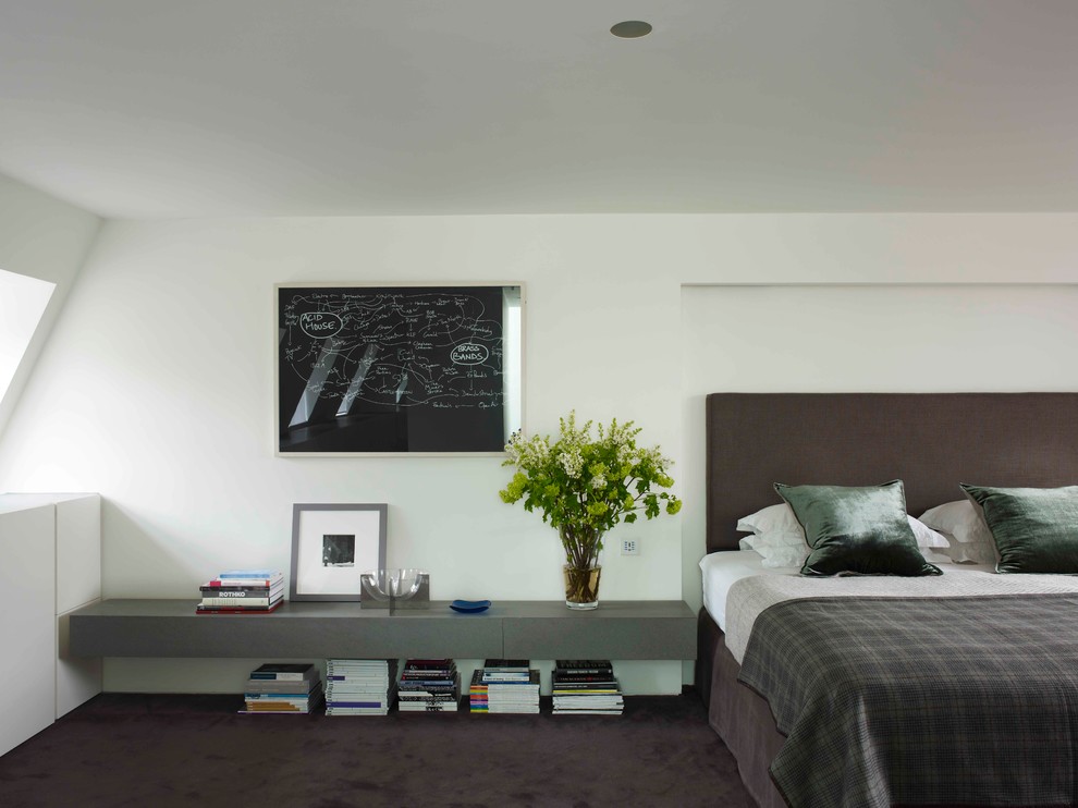 Design ideas for a modern bedroom in London with white walls and carpet.
