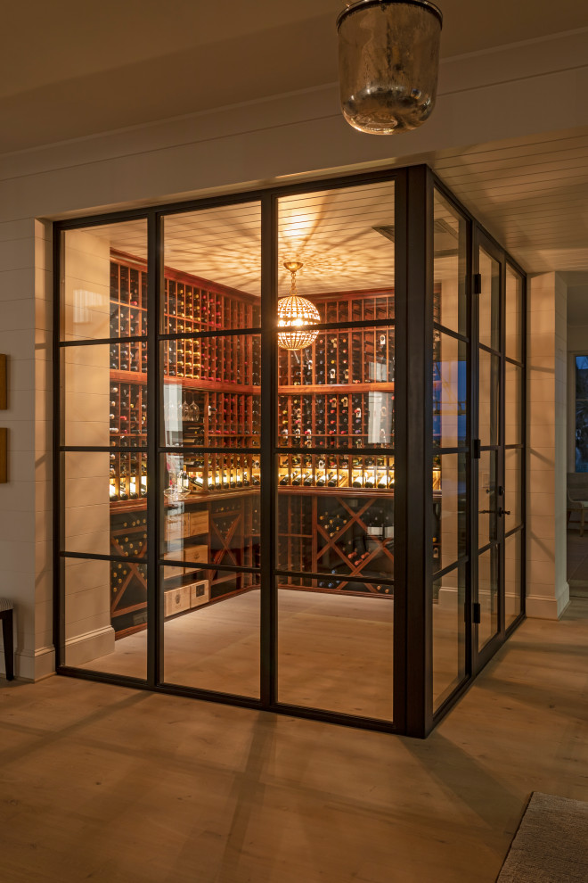 This is an example of a beach style wine cellar in Charleston.