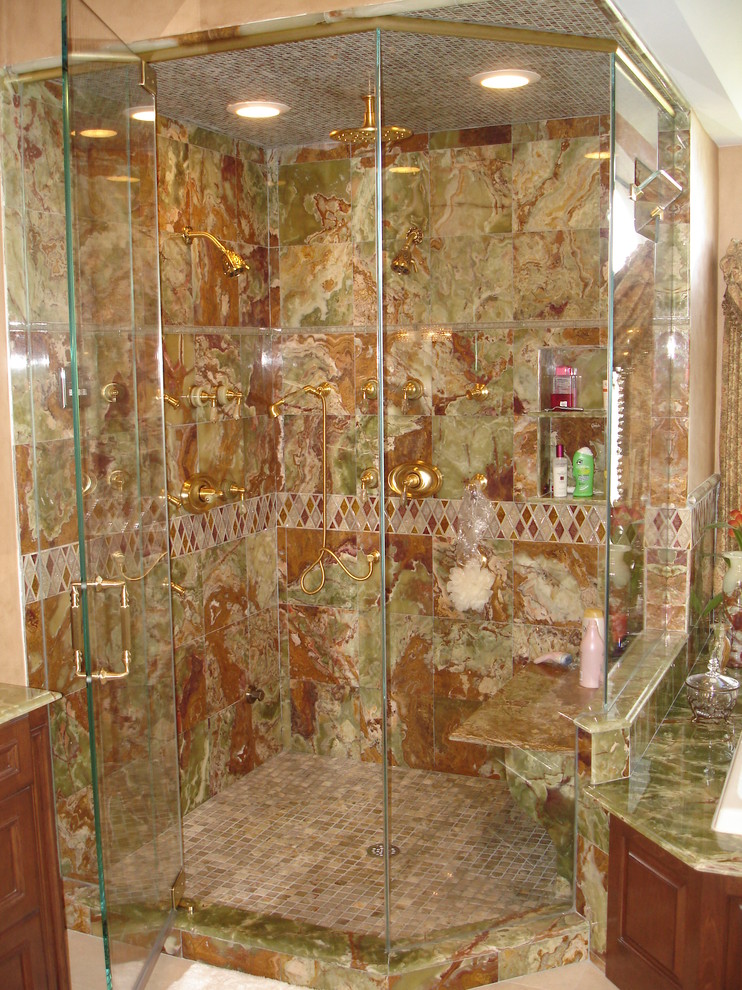 Photo of a mid-sized master bathroom in New York with a drop-in tub, an alcove shower, a one-piece toilet, beige tile, green tile, red tile, porcelain tile, beige walls and ceramic floors.