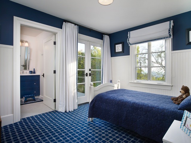 This is an example of a mid-sized contemporary kids' bedroom for kids 4-10 years old and boys in Los Angeles with blue walls.
