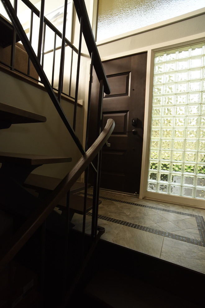 Inspiration for a transitional porcelain tile single front door remodel in Seattle