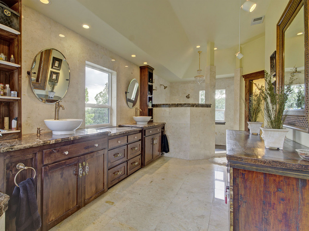 Inspiration for a master bathroom in Salt Lake City with shaker cabinets, distressed cabinets, a corner tub, an open shower, beige tile, marble, marble floors, a vessel sink, marble benchtops, beige floor, an open shower, brown benchtops, a shower seat, a double vanity, a built-in vanity and recessed.