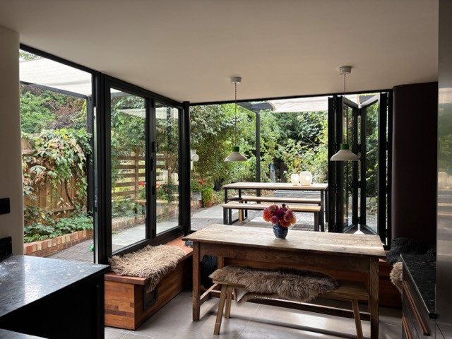 Kitchen Conversion with Bifolding windows and bench seating