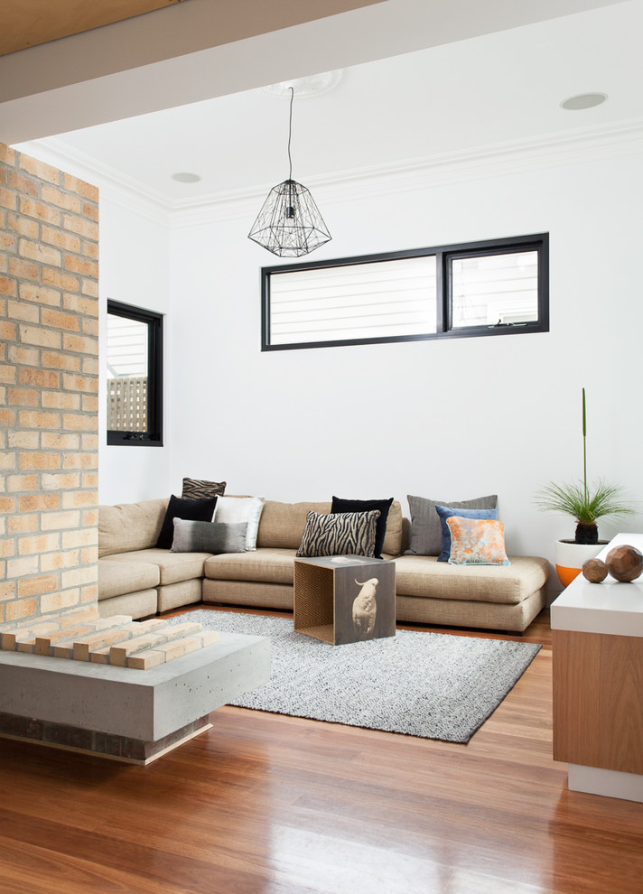 Contemporary open concept living room in Melbourne with white walls and medium hardwood floors.