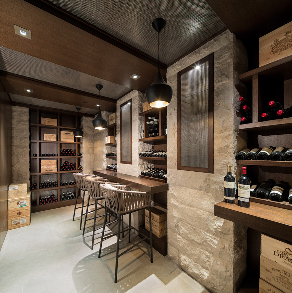 Large contemporary wine cellar in Vancouver with plywood floors, display racks and white floor.