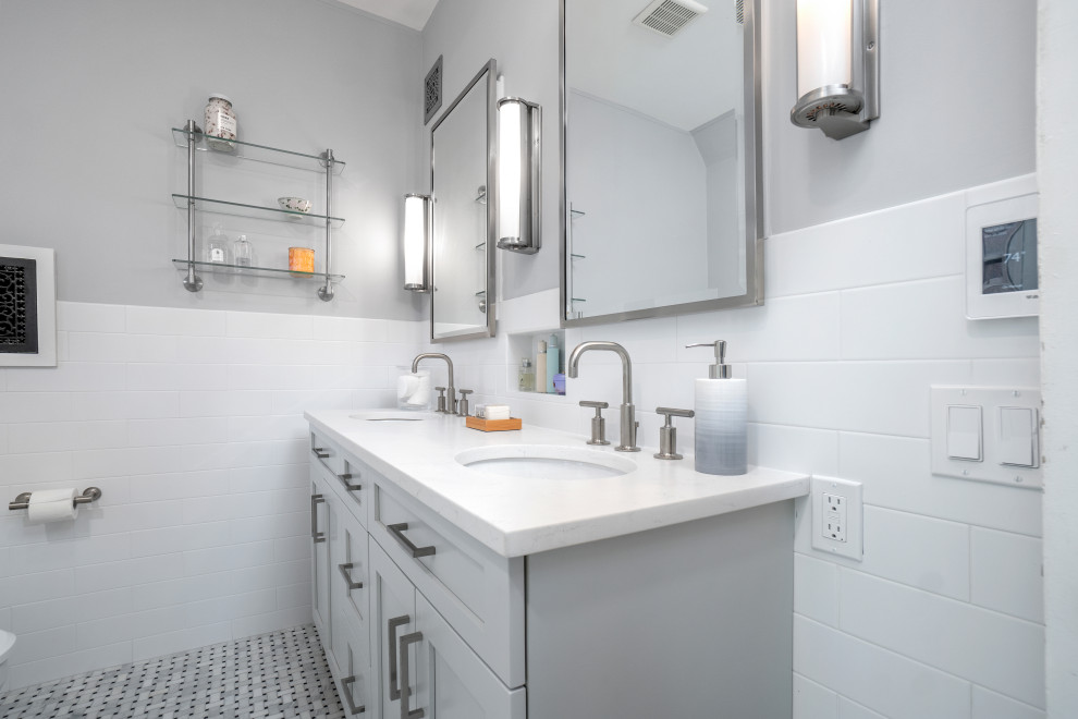 Photo of a small traditional master bathroom in Providence with shaker cabinets, grey cabinets, a corner shower, a bidet, white tile, ceramic tile, grey walls, marble floors, an undermount sink, engineered quartz benchtops, multi-coloured floor, a hinged shower door, white benchtops, a niche, a double vanity and a freestanding vanity.