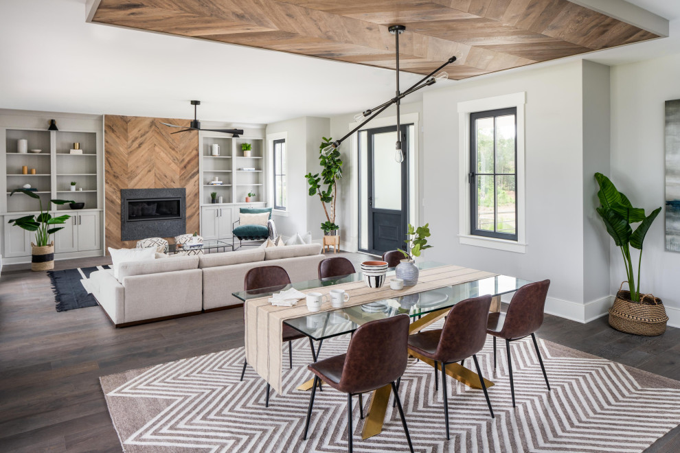 Inspiration for a beach style open plan dining in Charleston with grey walls, dark hardwood floors and wood.