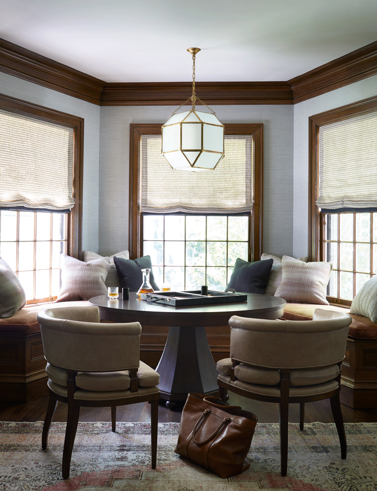 Photo of a traditional dining room in Boston with grey walls, dark hardwood floors and brown floor.
