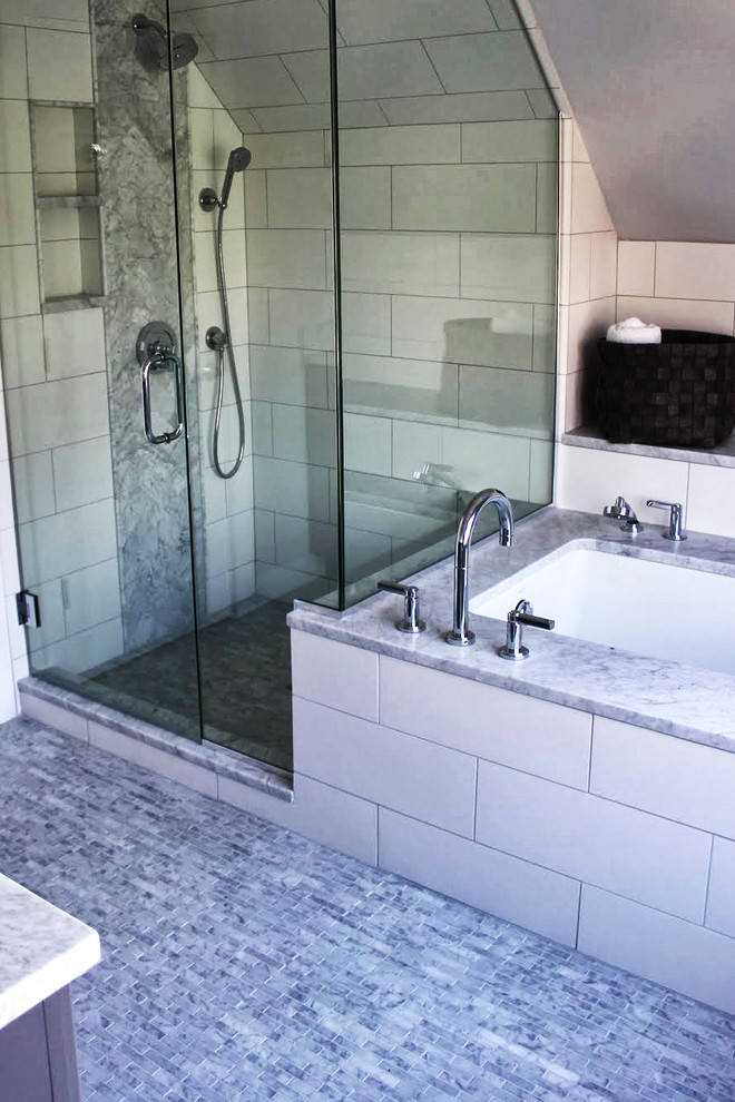 Contemporary bathroom in Chicago with an undermount sink, raised-panel cabinets, grey cabinets, marble benchtops, an undermount tub, a corner shower, a two-piece toilet and stone tile.