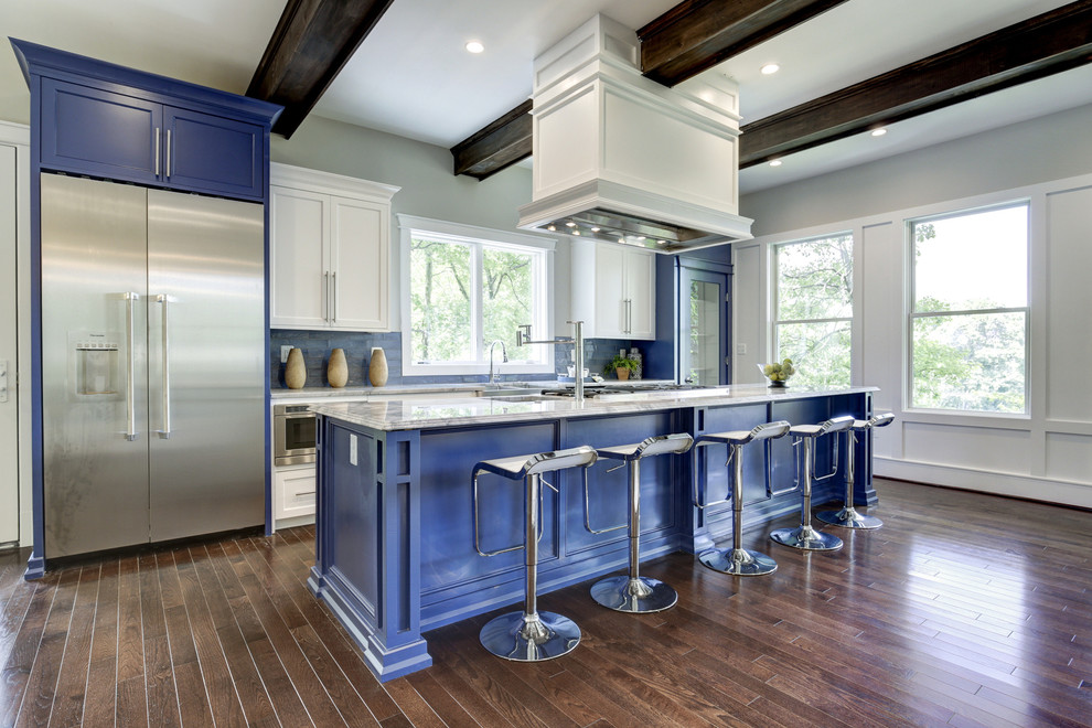 Design ideas for a mid-sized contemporary galley open plan kitchen in DC Metro with a farmhouse sink, shaker cabinets, blue cabinets, marble benchtops, stainless steel appliances and dark hardwood floors.