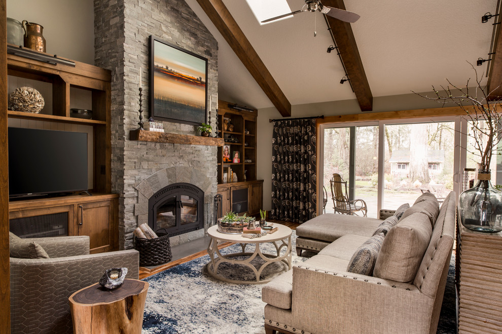 Mid-sized country open concept family room in Portland with white walls, medium hardwood floors, a standard fireplace and no tv.