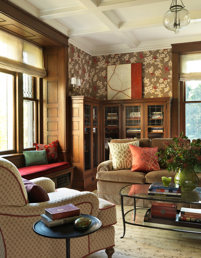 This is an example of a contemporary living room in Boston with a library and brown walls.