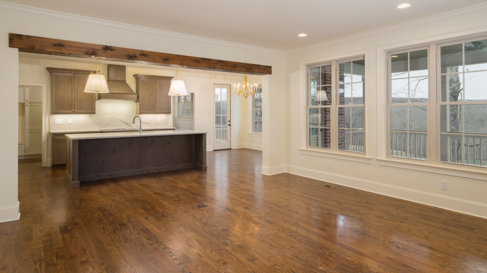 Example of a mid-sized transitional single-wall dark wood floor and brown floor eat-in kitchen design with a single-bowl sink, shaker cabinets, dark wood cabinets, granite countertops, white backsplash, stone slab backsplash, paneled appliances, an island and white countertops