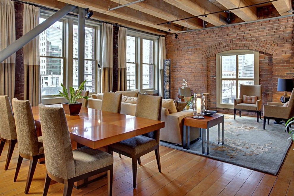 This is an example of an industrial dining room in Seattle with medium hardwood floors.