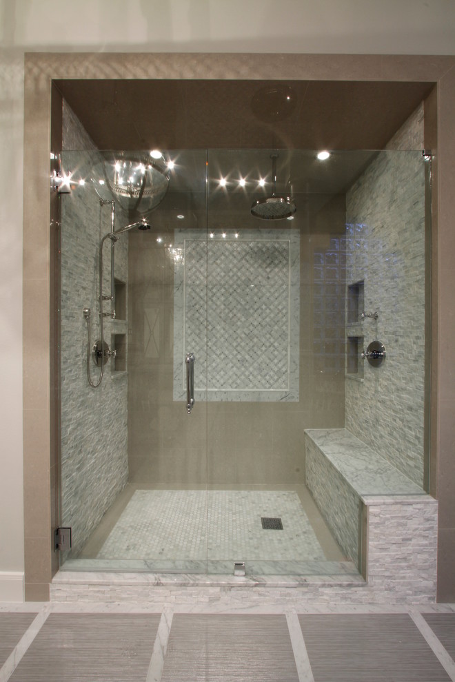This is an example of a large contemporary ensuite bathroom in Houston with freestanding cabinets, grey cabinets, a corner bath, a built-in shower, a one-piece toilet, multi-coloured tiles and porcelain tiles.