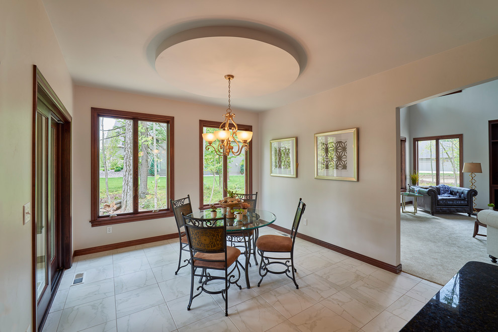 Kitchen/dining room combo - large transitional porcelain tile kitchen/dining room combo idea with white walls and no fireplace