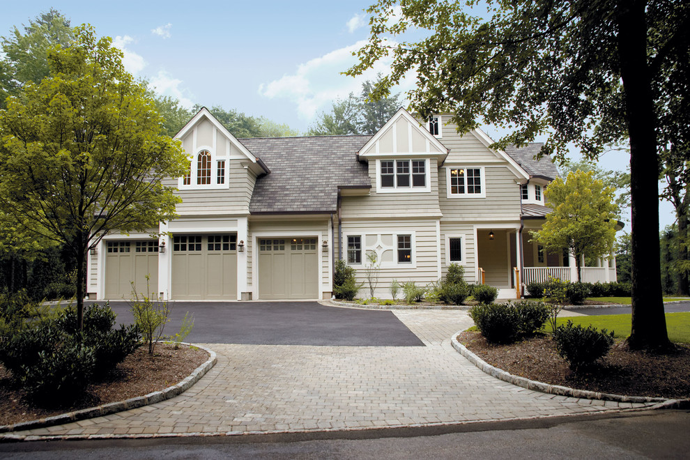 Inspiration for a large traditional two-storey beige exterior in New York with vinyl siding and a gable roof.