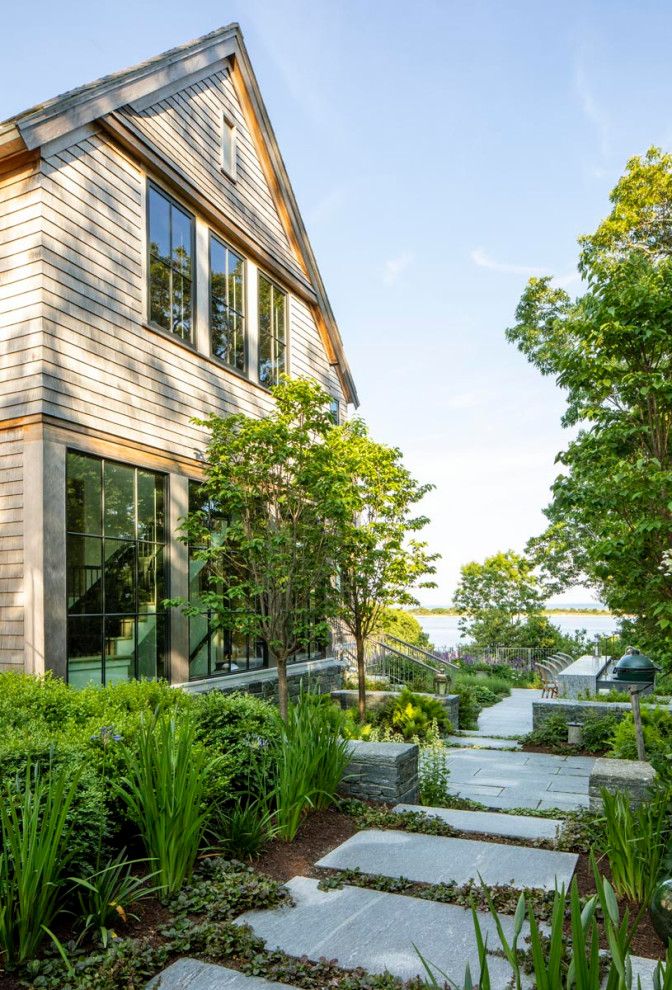 Example of a large transitional exterior home design in Boston