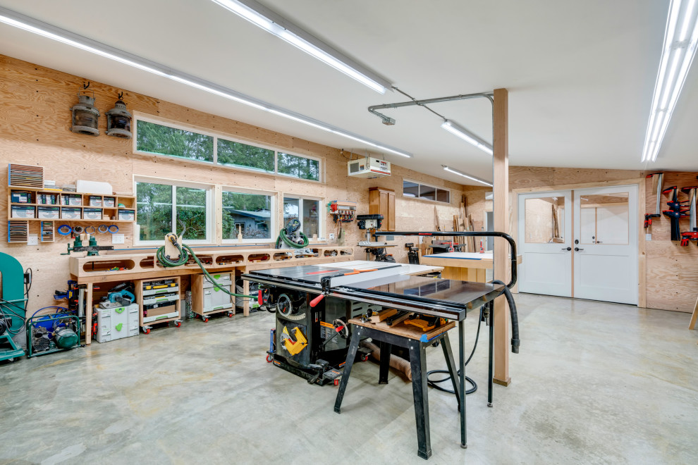 Large midcentury attached double garage workshop in Seattle.