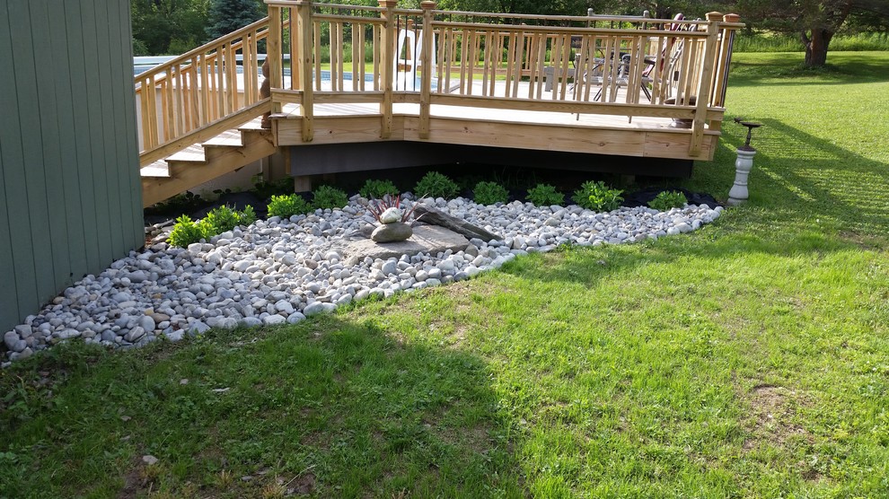 Inspiration for a large eclectic backyard deck remodel