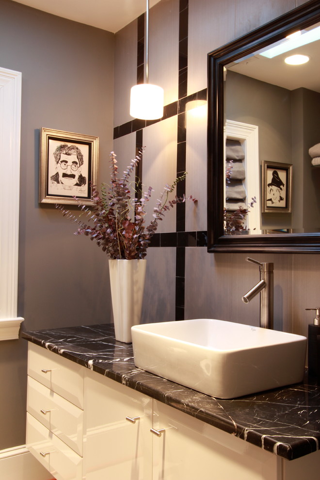 Design ideas for a mid-sized contemporary master bathroom in DC Metro with flat-panel cabinets, white cabinets, a freestanding tub, a curbless shower, a one-piece toilet, white tile, ceramic tile, purple walls, marble floors, a vessel sink and marble benchtops.