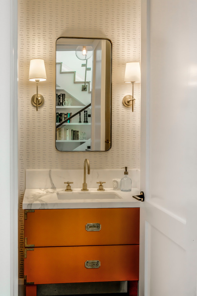Inspiration for a mid-sized transitional bathroom in San Francisco with flat-panel cabinets, orange cabinets, a corner shower, a two-piece toilet, white tile, white walls, medium hardwood floors, an undermount sink, marble benchtops and grey floor.