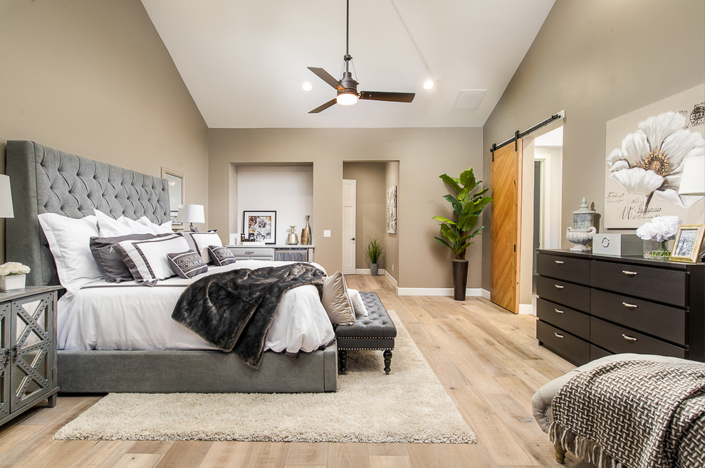 Inspiration for a large transitional master bedroom in Phoenix with grey walls, light hardwood floors and no fireplace.