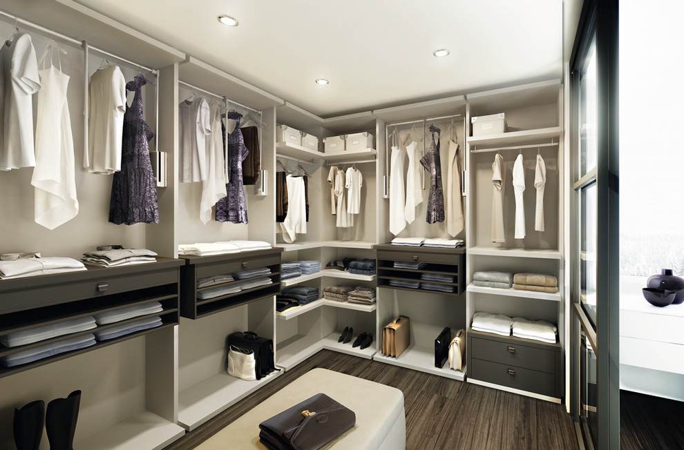 Inspiration for a mid-sized contemporary gender-neutral walk-in wardrobe in Toronto with open cabinets, white cabinets, dark hardwood floors and brown floor.