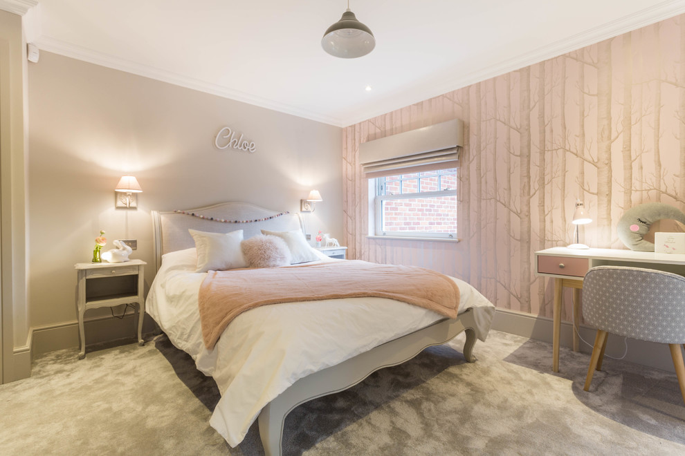 Design ideas for a transitional kids' bedroom for girls in Kent with pink walls, carpet and grey floor.