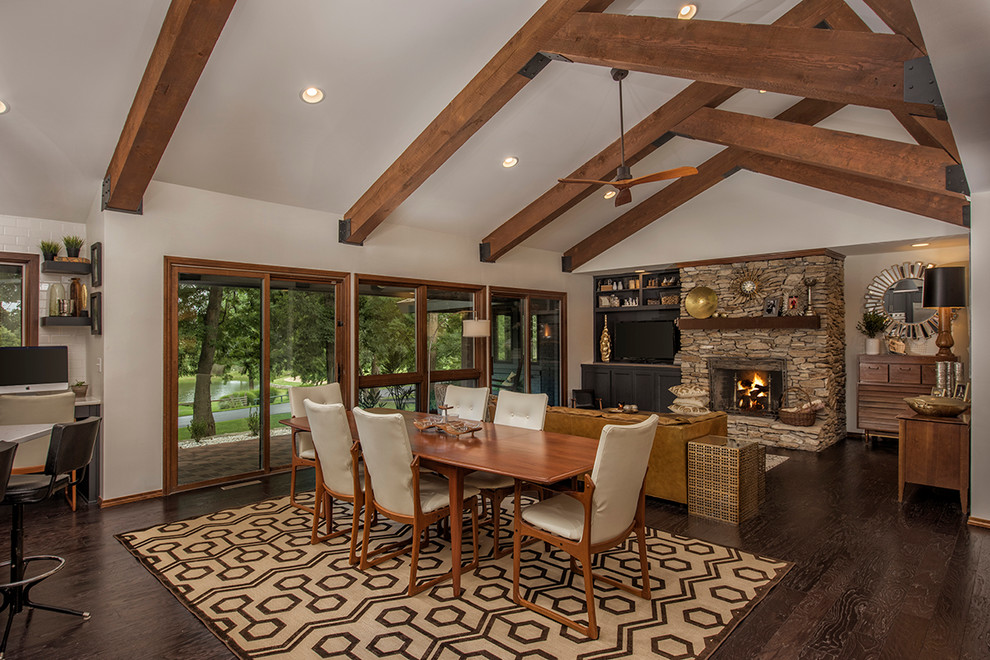 Country open plan dining in Other with white walls and dark hardwood floors.