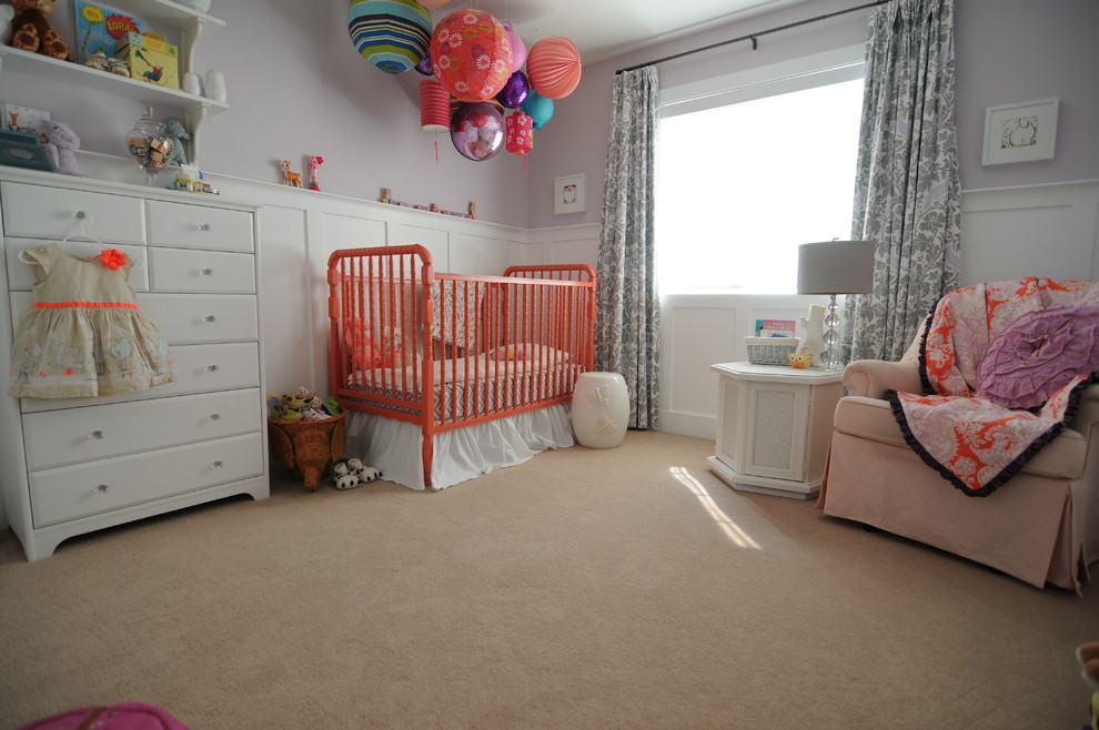 Design ideas for a mid-sized transitional nursery for girls in Calgary with purple walls and carpet.
