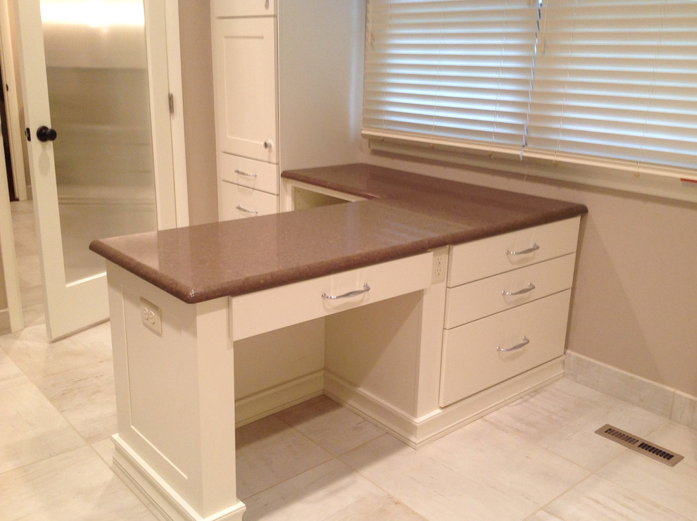 Transitional walk-in wardrobe in Wichita with flat-panel cabinets, white cabinets and porcelain floors.