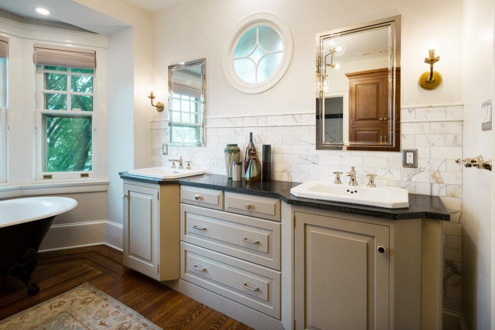 This is an example of a large classic ensuite bathroom in Philadelphia with beige cabinets, a double shower and double sinks.