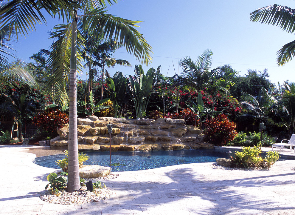 Inspiration for a tropical custom-shaped pool in Miami.
