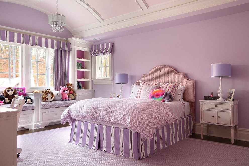 This is an example of a traditional kids' bedroom for girls in New York with purple walls, dark hardwood floors and brown floor.