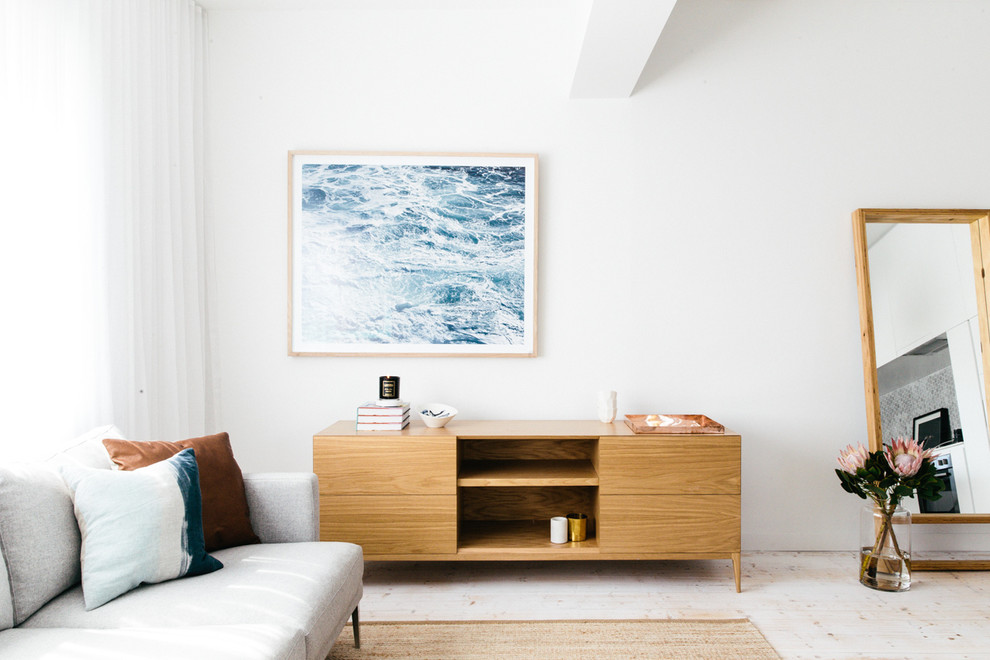 Inspiration for a mid-sized scandinavian living room in Sydney with painted wood floors.