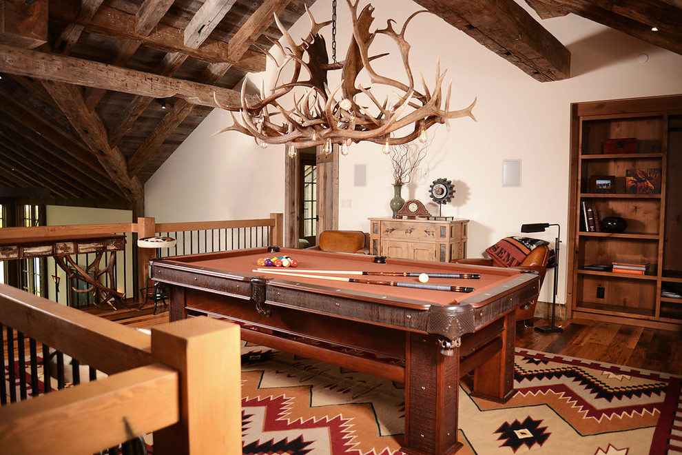 Example of a mid-sized mountain style loft-style dark wood floor living room design with white walls, no fireplace and no tv