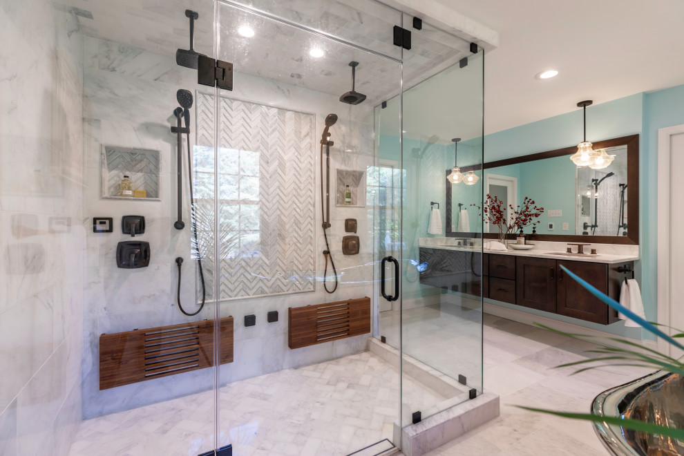 Design ideas for a small contemporary master bathroom in DC Metro with dark wood cabinets, a freestanding tub, a double shower, a one-piece toilet, blue walls, marble floors, marble benchtops, grey floor, a hinged shower door, white benchtops, a shower seat, a double vanity and a floating vanity.