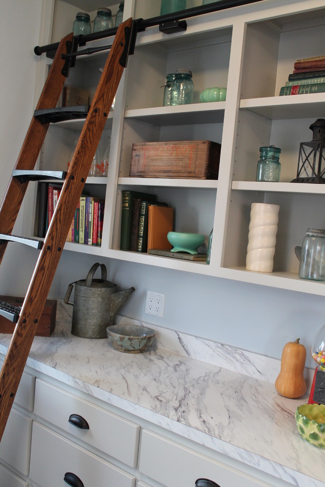 Kitchen pantry - mid-sized transitional single-wall medium tone wood floor kitchen pantry idea with flat-panel cabinets, white cabinets and quartz countertops