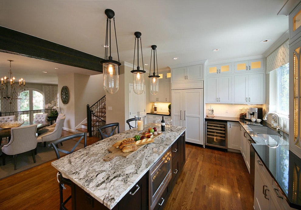 Inspiration for a large transitional medium tone wood floor kitchen remodel in Houston with an undermount sink, recessed-panel cabinets and an island