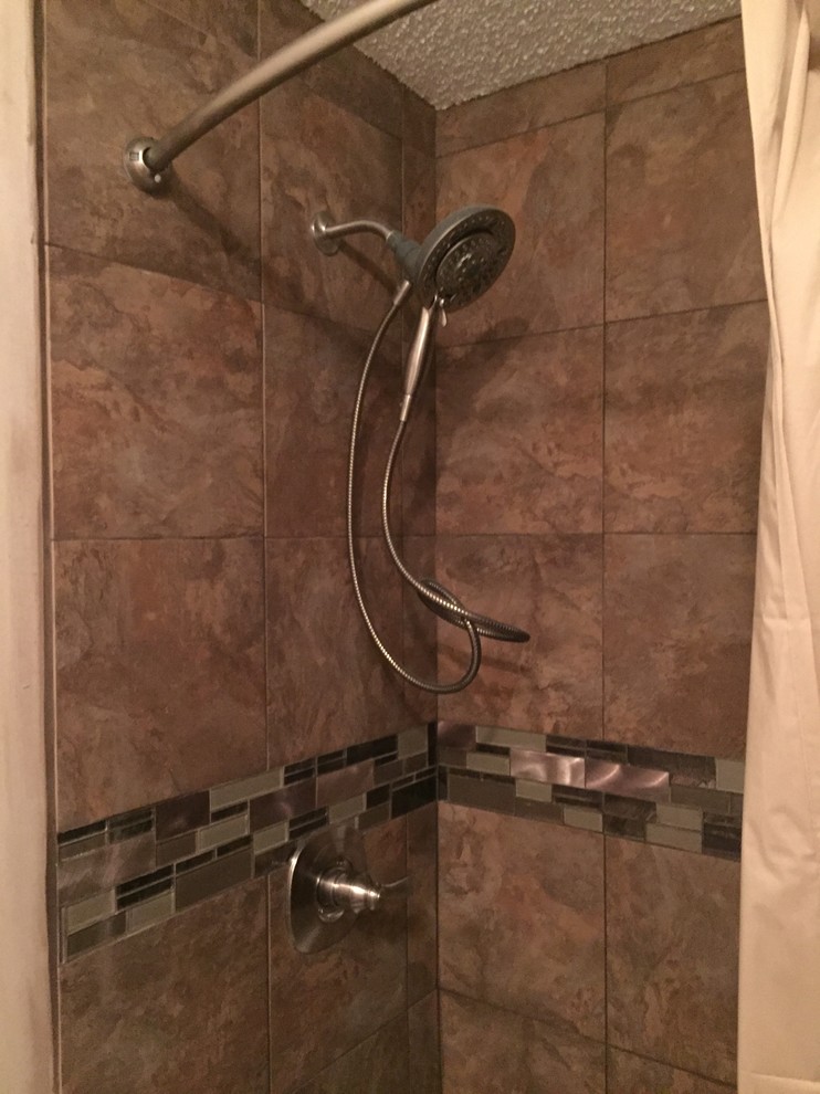 Inspiration for a mid-sized transitional kids' brown tile and porcelain tile alcove bathtub remodel