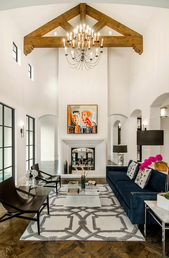 Photo of a mediterranean formal living room in Dallas with white walls, dark hardwood floors and a two-sided fireplace.