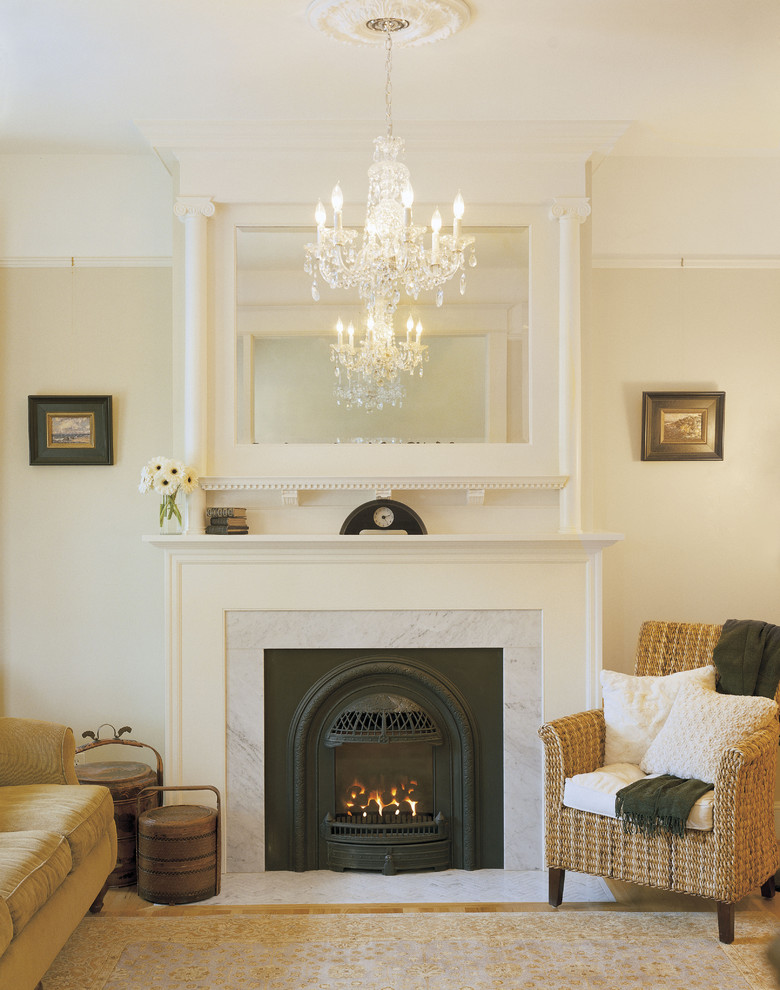 Inspiration for a traditional living room in Portland with beige walls and a standard fireplace.