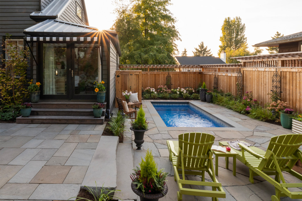 Inspiration for a small eclectic backyard stone and rectangular infinity pool landscaping remodel in Seattle