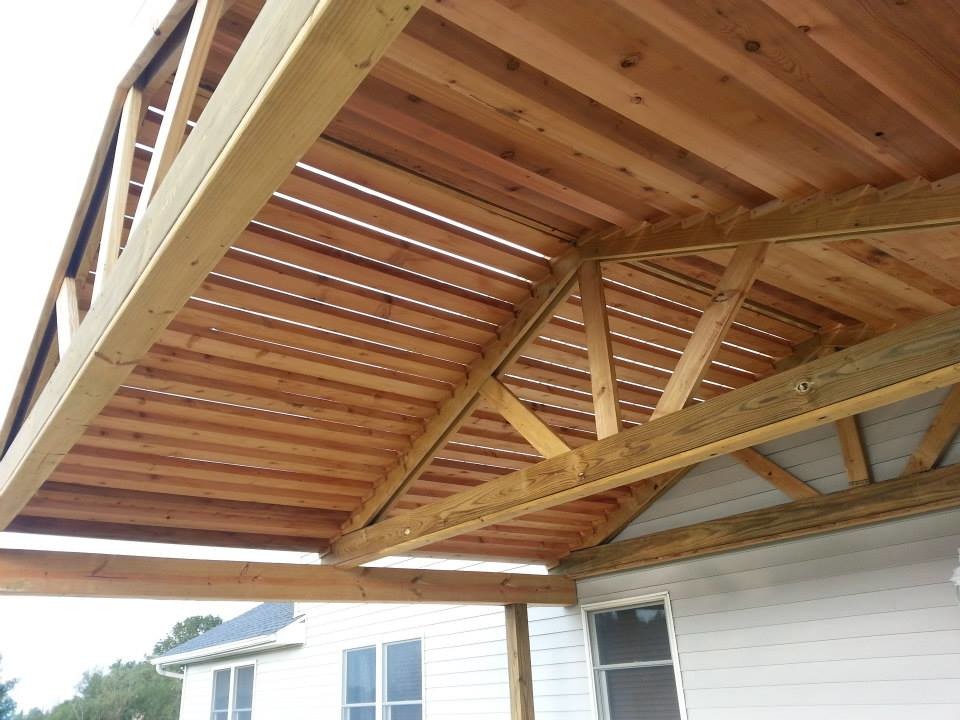 Inspiration for a large arts and crafts backyard deck in Indianapolis with a pergola.